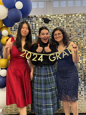 three girls holding gold banner that reads "2024 grad"