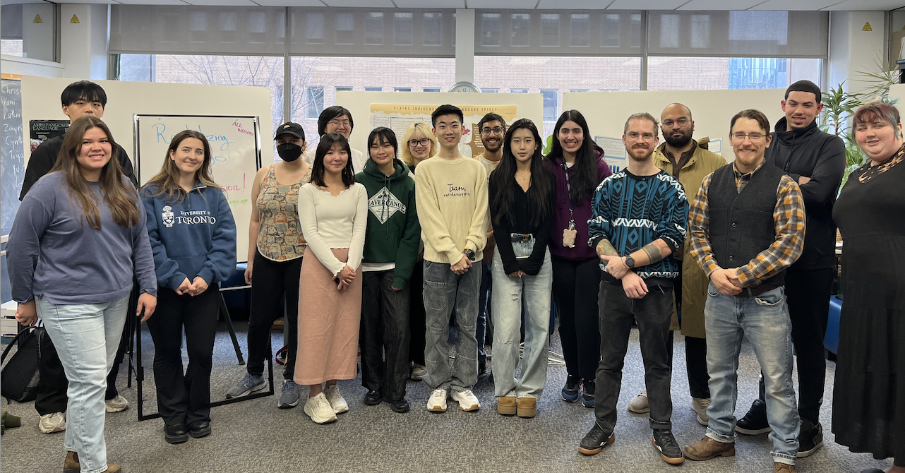 LIN458 students and professor decaire gathered for a group photo in the linguistics lounge