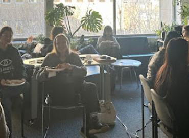 grad students gathered in the linguistics lounge